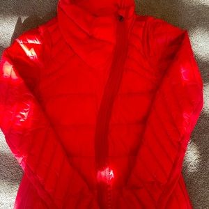 **RARE**. LULULEMON Orange Down Asymmetrical zip .  With optional drop skirt